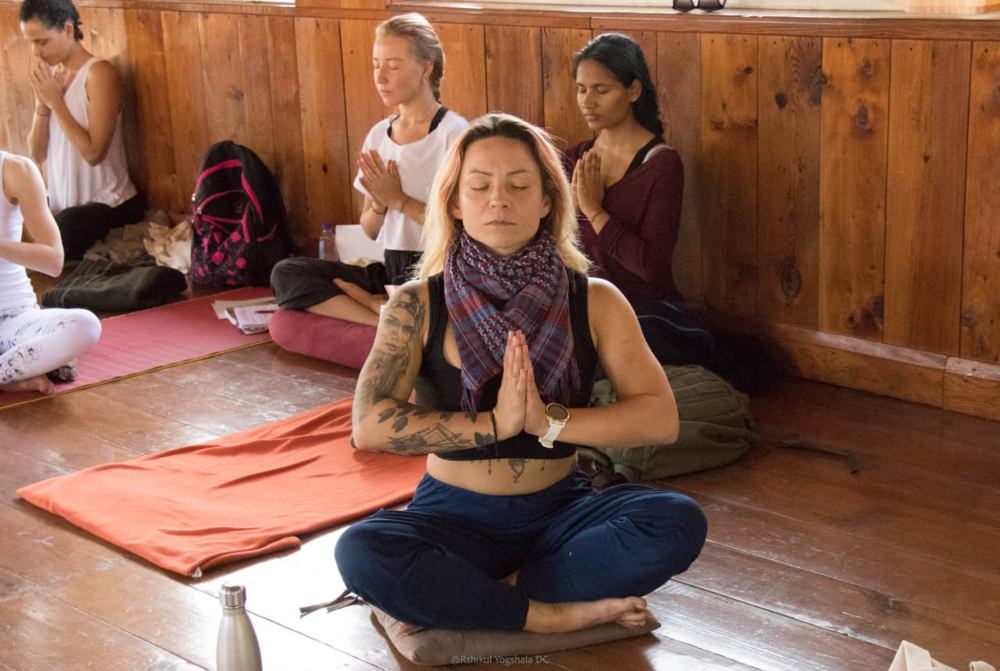 yoga teacher training student performing meditation yoga teacher training student performing meditation