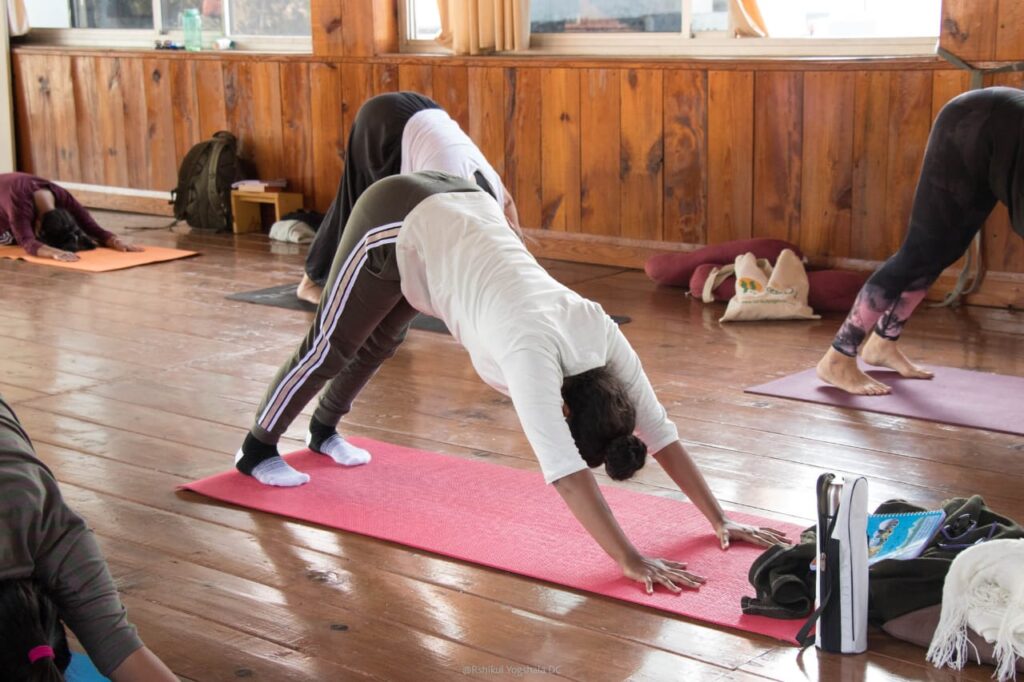 Students Performing Yoga Asanas Students Performing Yoga Asanas