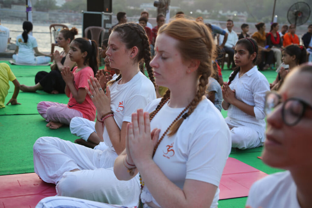 Students Practicing Yoga & Meditaion in Yoga Session at Yoga School Students Practicing Yoga & Meditaion in Yoga Session at Yoga School