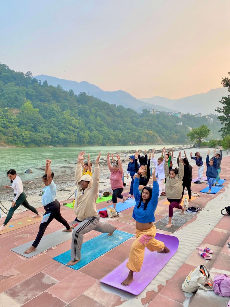 Outdoor Yoga Class by the River – Warrior Pose Practice Outdoor Yoga Class by the River – Warrior Pose Practice