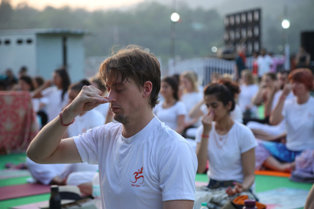 YTTC students performing Nadi Shodhana Pranayama at Rishikul Yogshala, Rishikesh YTTC students performing Nadi Shodhana Pranayama at Rishikul Yogshala, Rishikesh