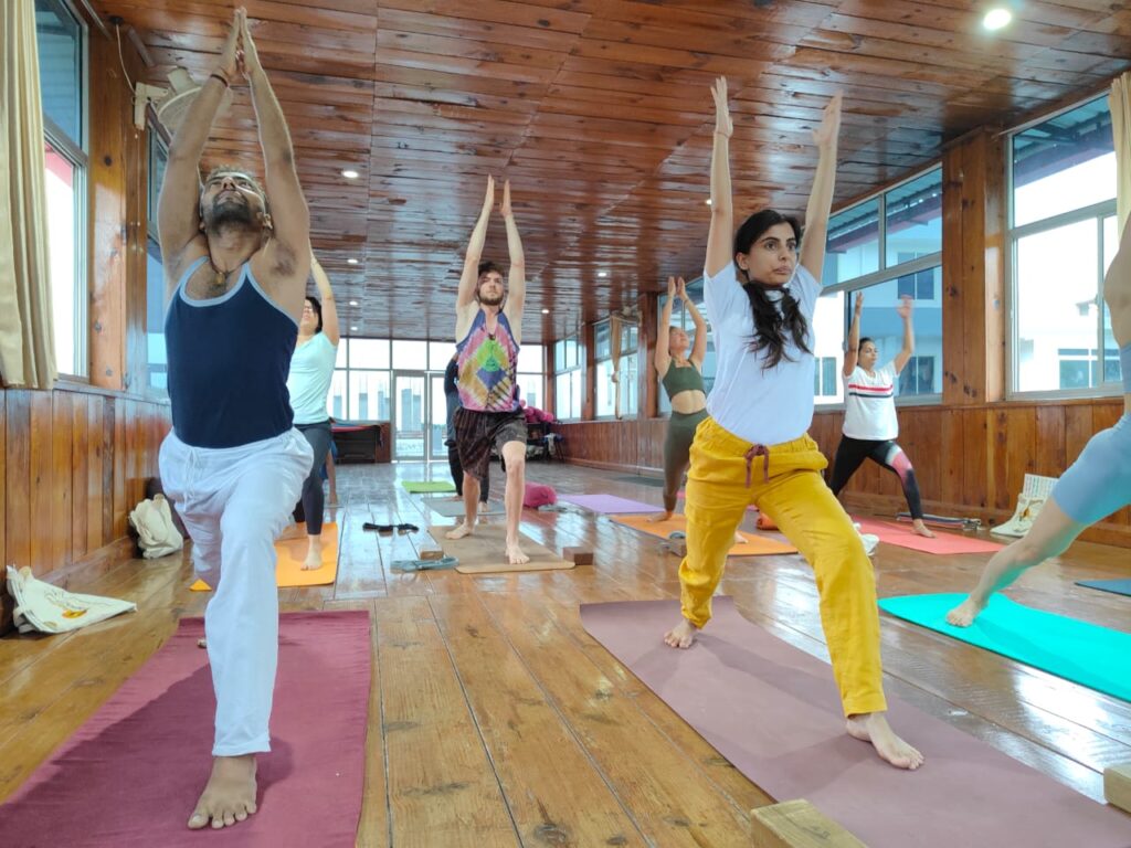 Students practicing yoga during Yoga Teacher Training at Rishikul Yogshala Students practicing yoga during Yoga Teacher Training at Rishikul Yogshala