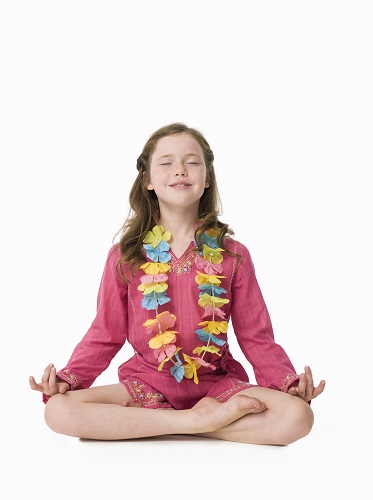 Kid Performing Ardha Padmasana or Half-Lotus Pose Kid Performing Ardha Padmasana or Half-Lotus Pose