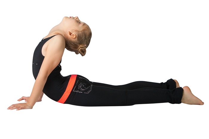 Kid Performing Bhujangasana or Cobra Pose Kid Performing Bhujangasana or Cobra Pose