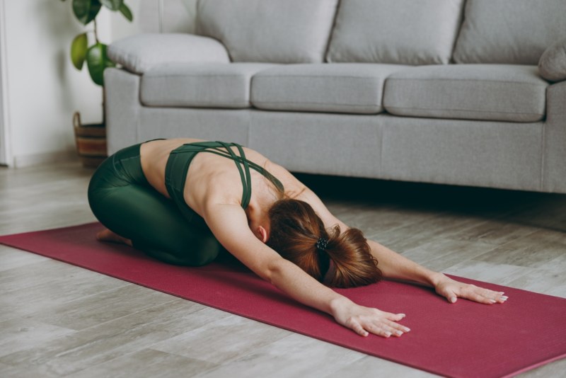 Yoga Student Performing Child Pose Yoga Student Performing Child Pose