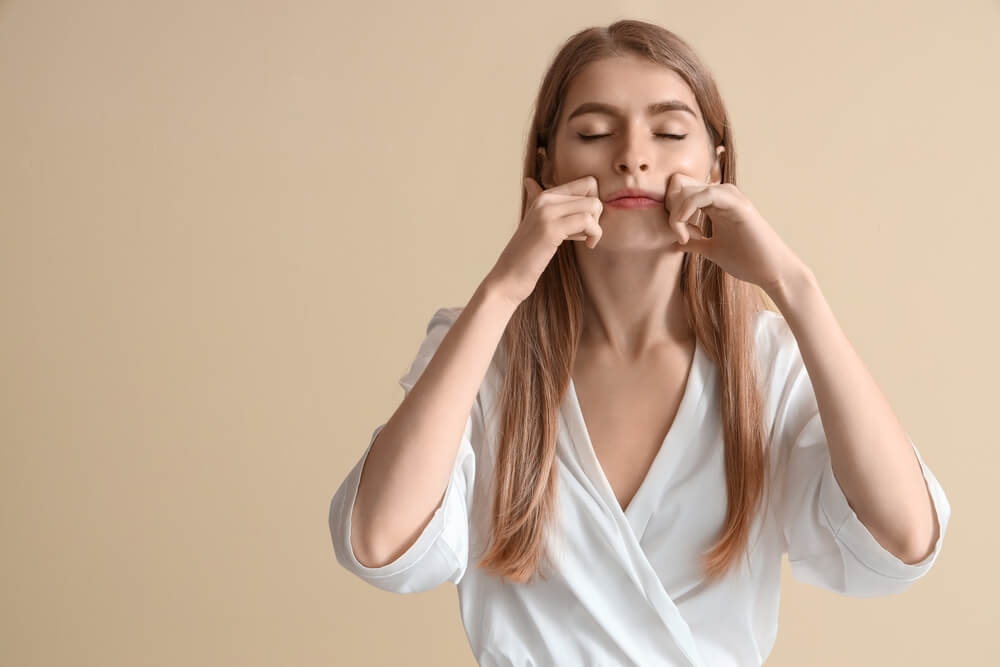 Women Doing Facial Yoga to Reduce Dark Circle Women Doing Facial Yoga to Reduce Dark Circle