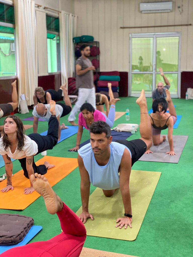 Students of Yoga Teacher Training Practicing Yoga Poses Students of Yoga Teacher Training Practicing Yoga Poses