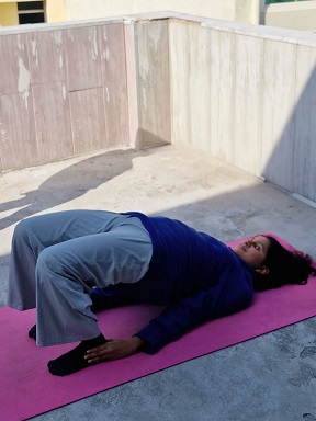 Student performing  Bridge Pose (Setu Bandhasana) during yoga teacher training in Rishikesh
