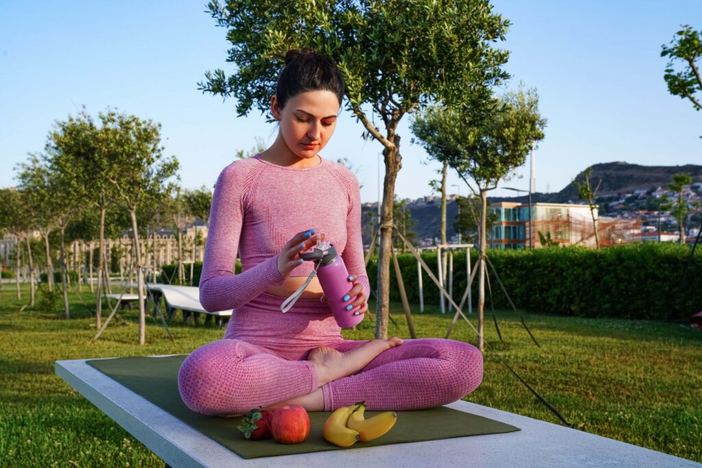 Woman Practicing Pre-Yoga Routine Before Yoga Session Woman Practicing Pre-Yoga Routine Before Yoga Session