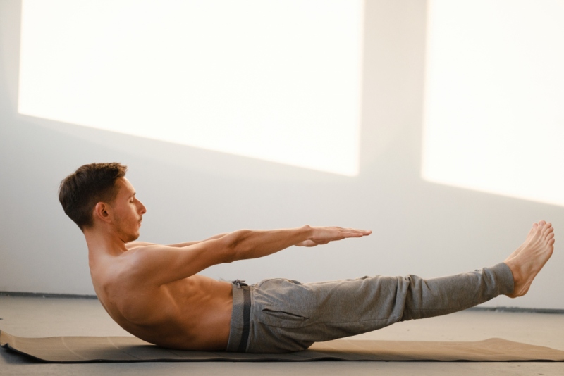 Yoga Student Performing Ardhanavasana Yoga Student Performing Ardhanavasana