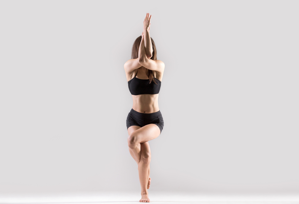 Women Performing Garudasana Women Performing Garudasana
