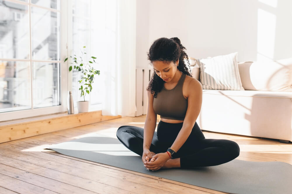Women Doing Butterfly Pose to Boost Blood Circulation Women Doing Butterfly Pose to Boost Blood Circulation