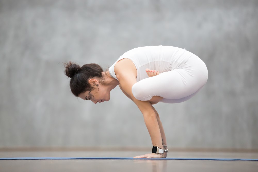 Yoga TTC Student Performing Kukkutasana Yoga TTC Student Performing Kukkutasana