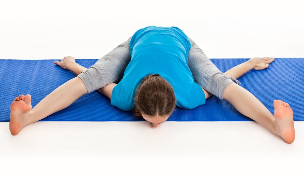 Yoga Student Performing Kurmasana Yoga Student Performing Kurmasana