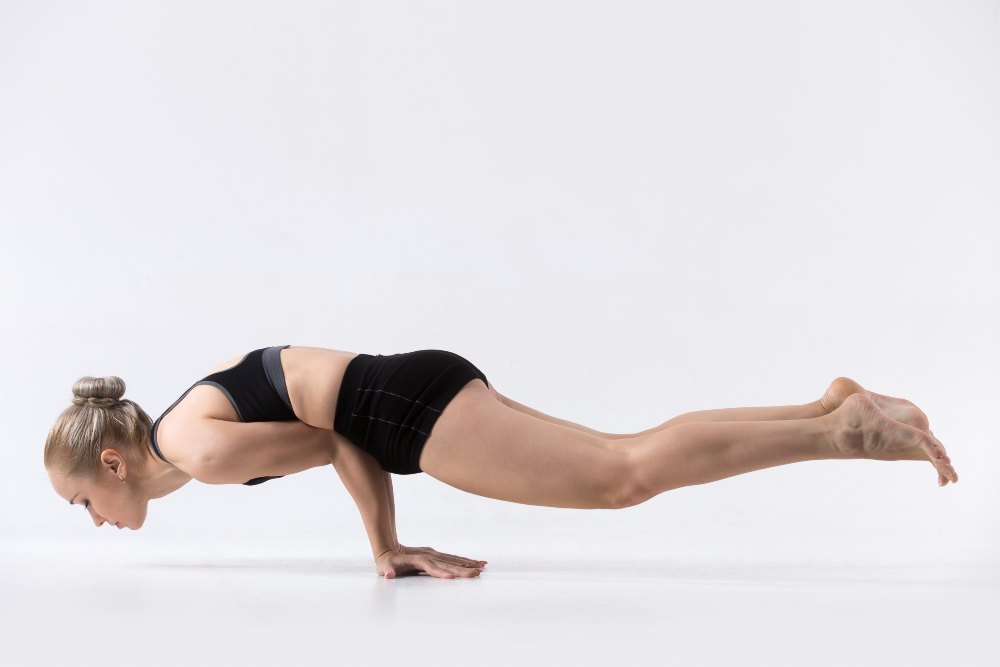 Yoga Student Performing Mayurasana Yoga Student Performing Mayurasana