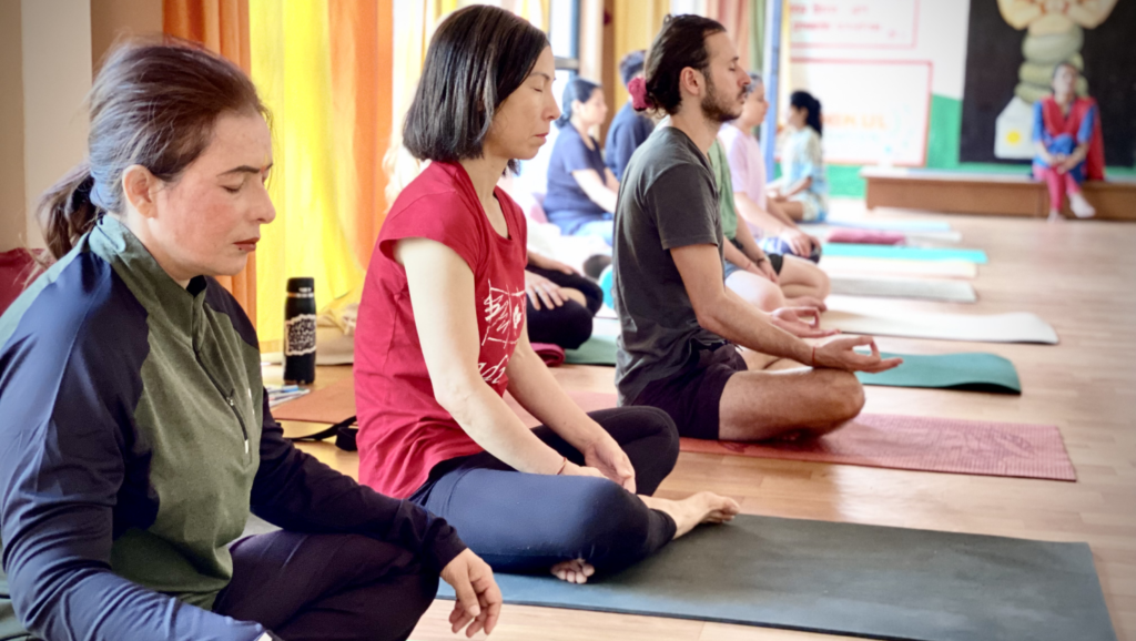 Students Performing Mantras at Rishikul Yogshala Rishikesh Students Performing Mantras at Rishikul Yogshala Rishikesh