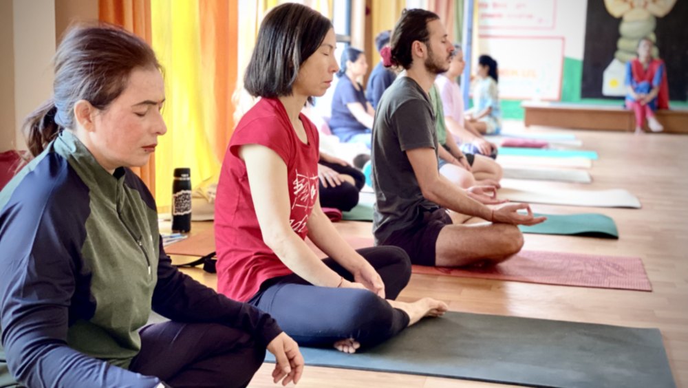 Students Performing Mantras at Rishikul Yogshala Rishikesh Students Performing Mantras at Rishikul Yogshala Rishikesh