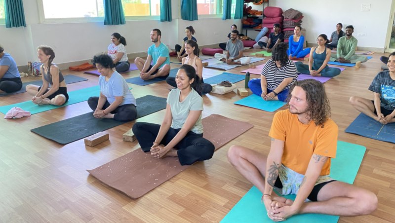 Yoga TTC Students Practicing Butterfly Asana