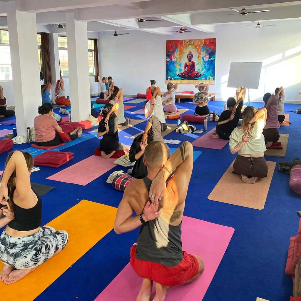 Yoga Class at Rishikul Yogshala Rishikesh A group of yoga practitioners at Rishikul Yogshala in Rishikesh