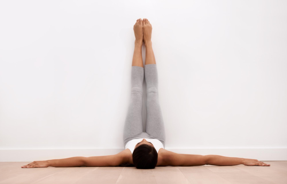 Yoga Teacher Performing Viparita Karani Yoga Teacher Performing Viparita Karani