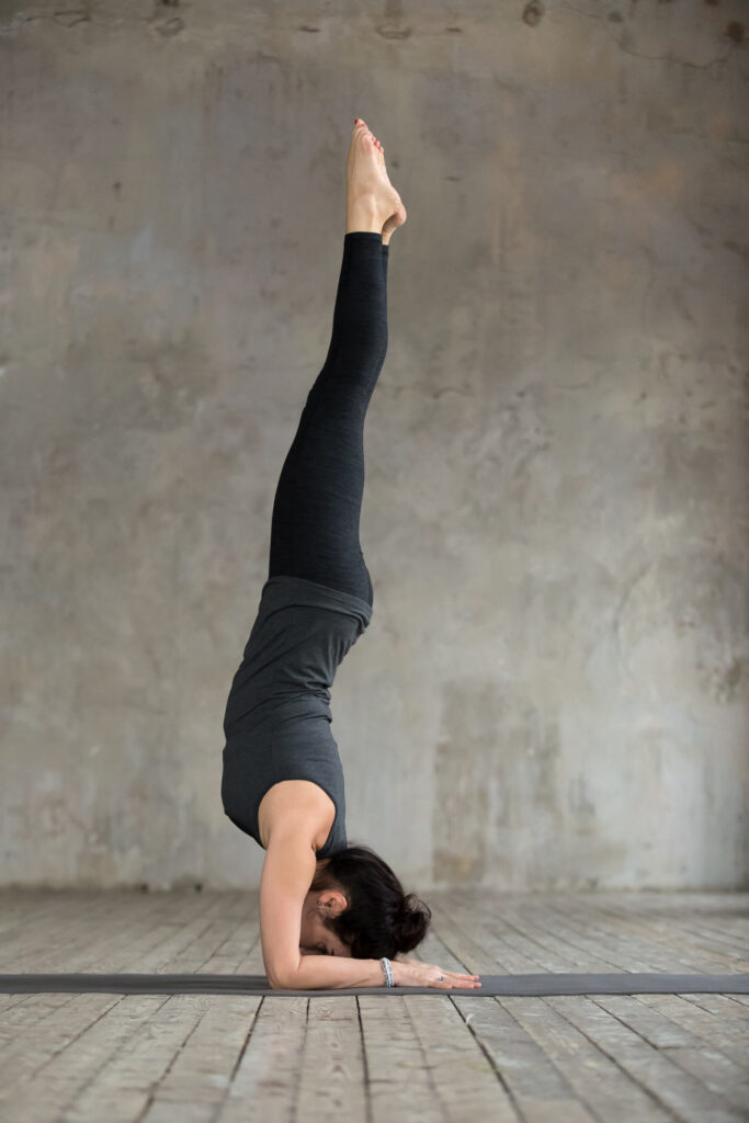 Yoga Student Performing Pincha Mayurasana