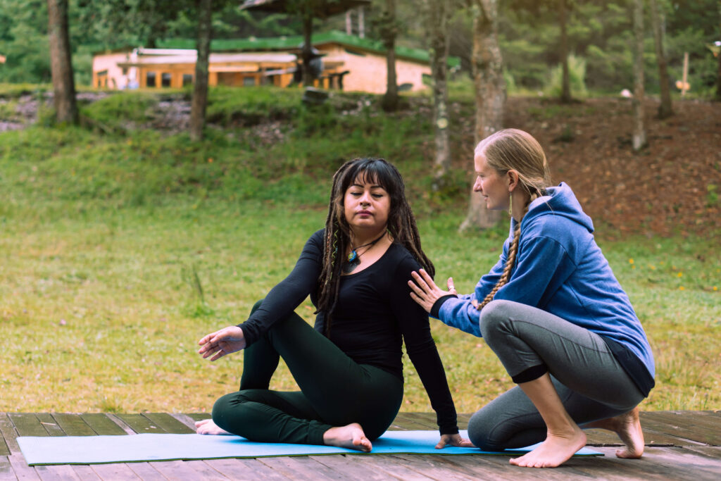 Yoga Teacher Guiding Yoga Student Yoga Teacher Guiding Yoga Student
