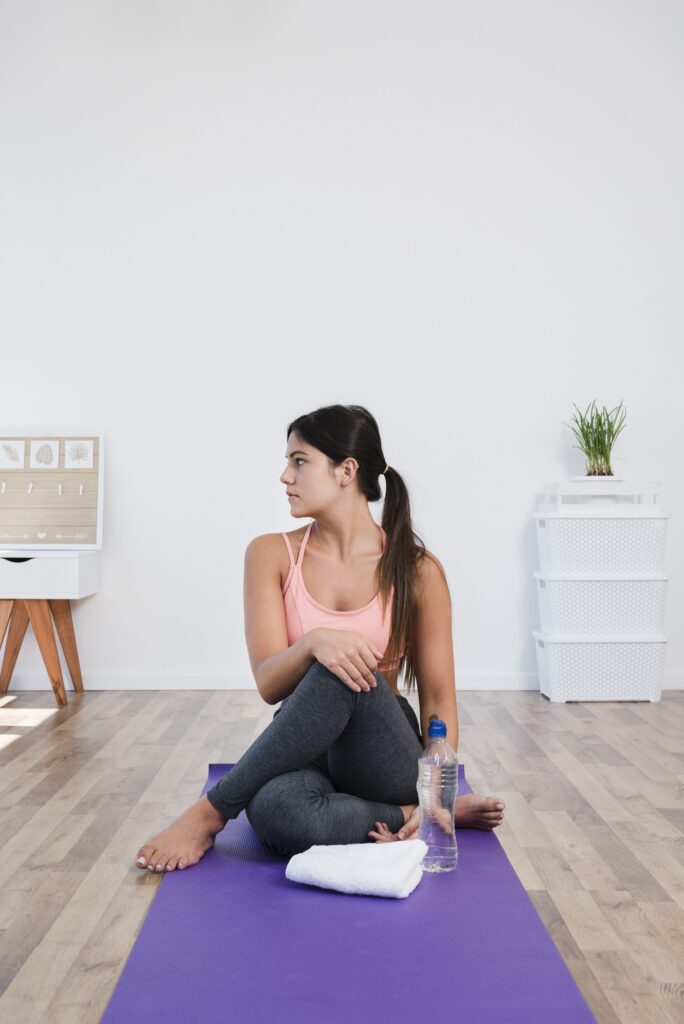 Student Practicing Pre-Yoga Routine Before Yoga Session Woman Practicing Pre-Yoga Routine Before Yoga Session