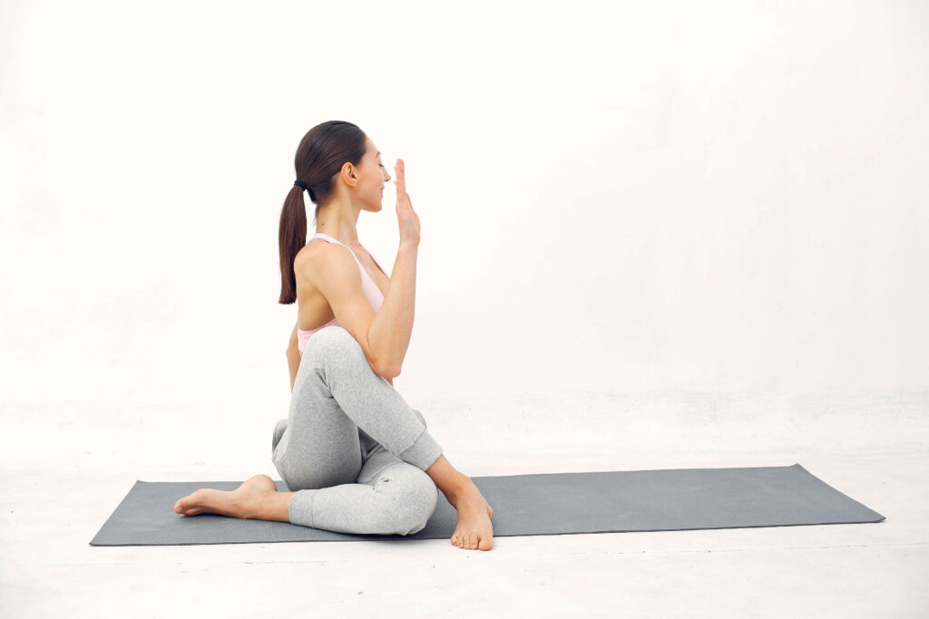 Yoga Practitioner Performing Matsyendrasana Yoga Practitioner Performing Matsyendrasana
