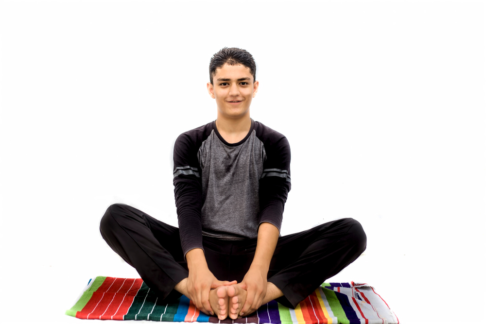 Yoga Practitioner Performing Bhadrasana Yoga Practitioner Performing Bhadrasana