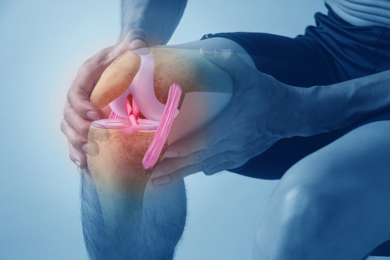 Person holding knee in pain