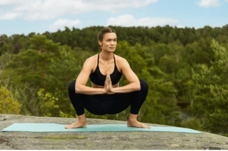 Garland Pose (Malasana) Yoga Practice in a Natural Setting