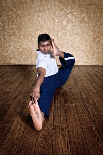 Student Performing Akarna Dhanurasana Student Performing Akarna Dhanurasana