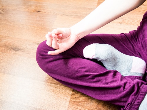 Student Practicing Apana Vayu Mudra Student Practicing Apana Vayu Mudra