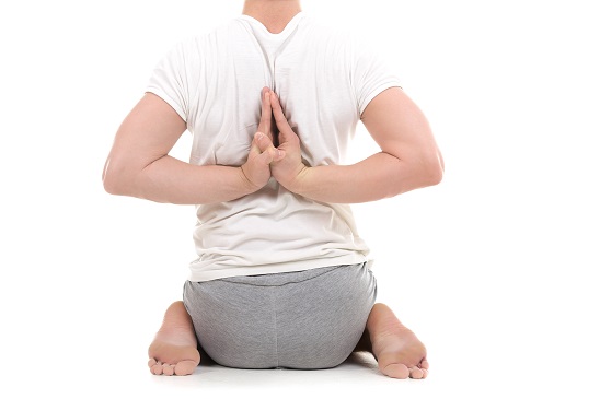Student Practicing Paschim Namaskarasana or Reverse Prayer Pose Student Practicing Paschim Namaskarasana or Reverse Prayer Pose