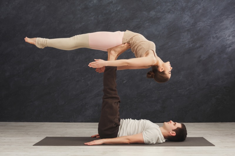 Yoga Students Practising AcroYoga Pose Yoga Students Practising AcroYoga Pose
