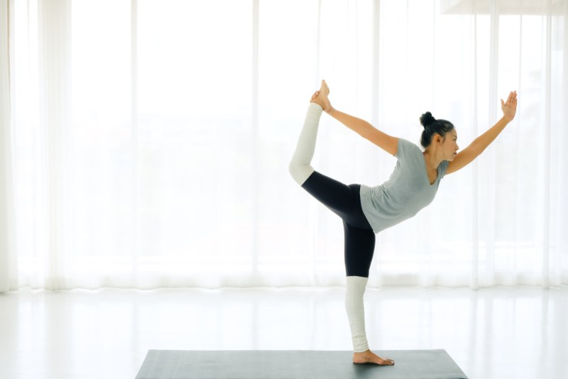 Yoga Student Practicing Dancer Pose Yoga Student Practicing Dancer Pose