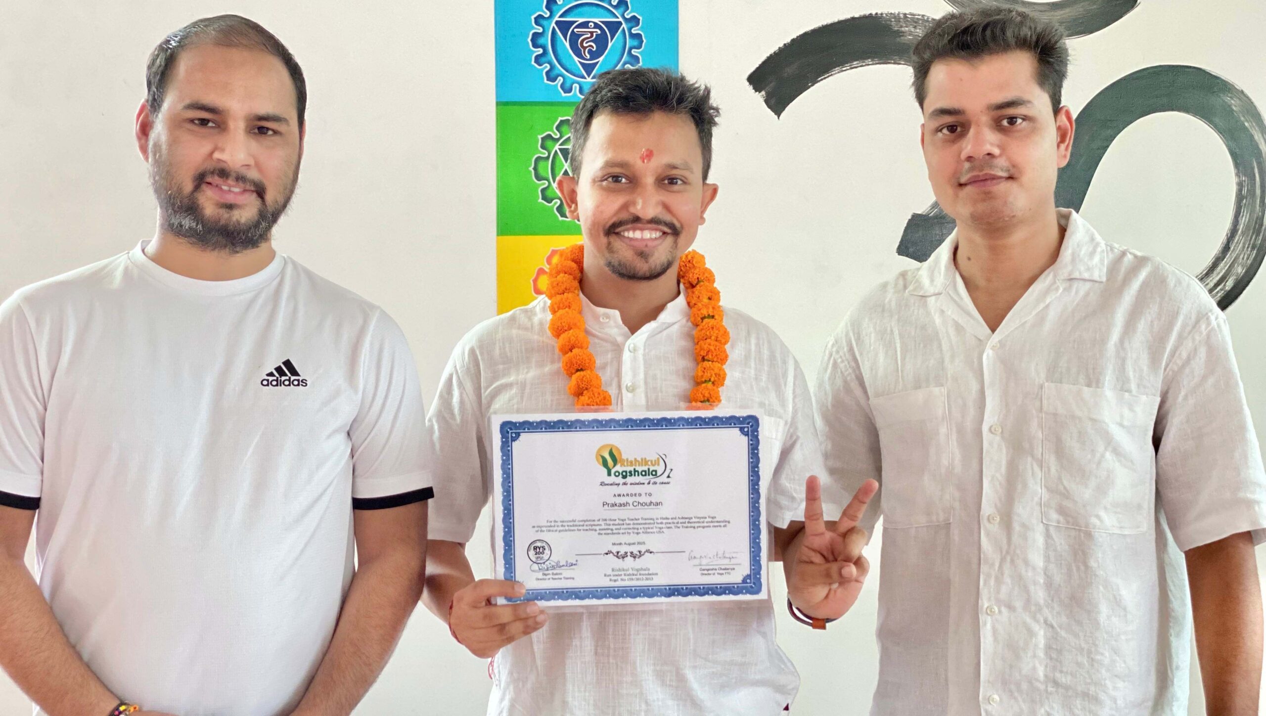 Yoga Instructors with student Yoga Instructors with student