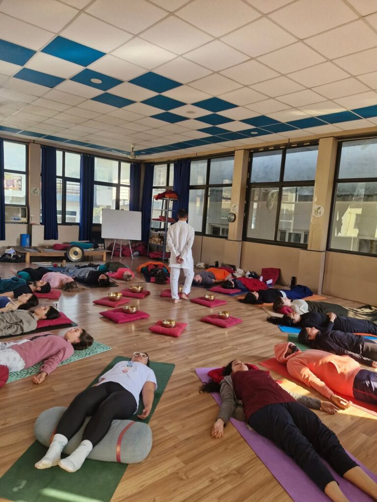 Students practicing sound healing at Rishikul Yogshala