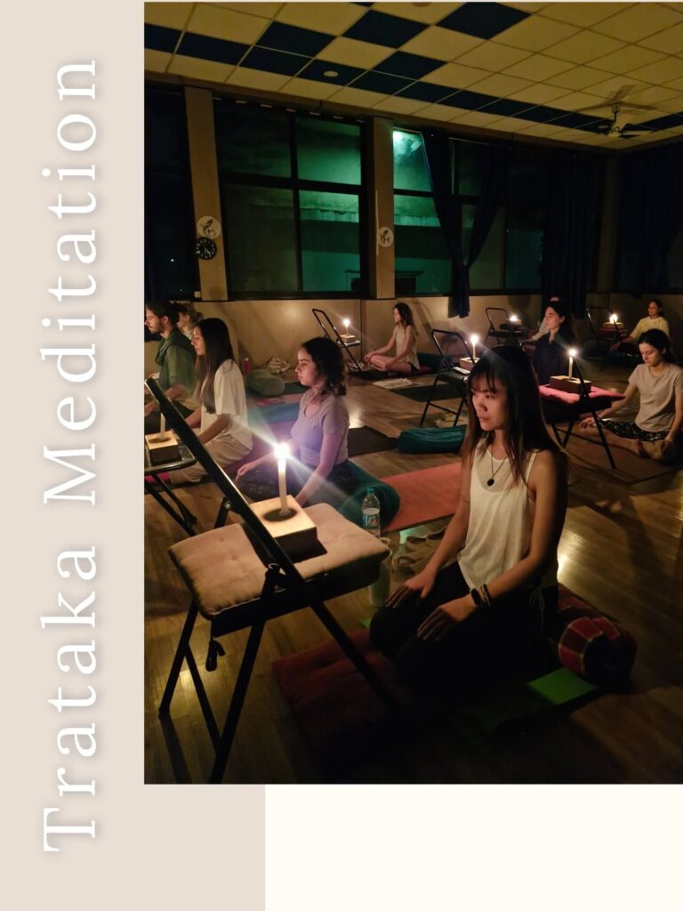 A Group of Students Practising Trataka Meditation at Rishikul Yogshala A Group of Students Practising Trataka Meditation at Rishikul Yogshala