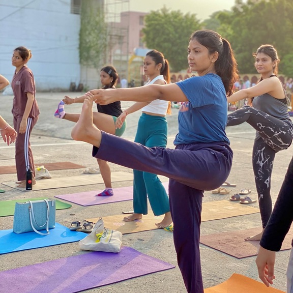 Student Practising Padangusthasana — Big Toe Pose During Yoga TTC at Rishikul Yogshala Rishikesh