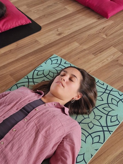 Student Practicing Shavasana (Corpse Pose) During YTTC