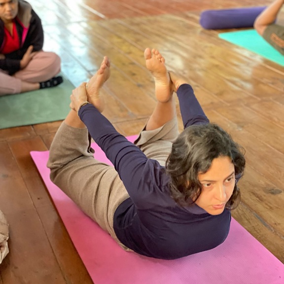 Student Practising Dhanurasana During YTTC in Rishikesh