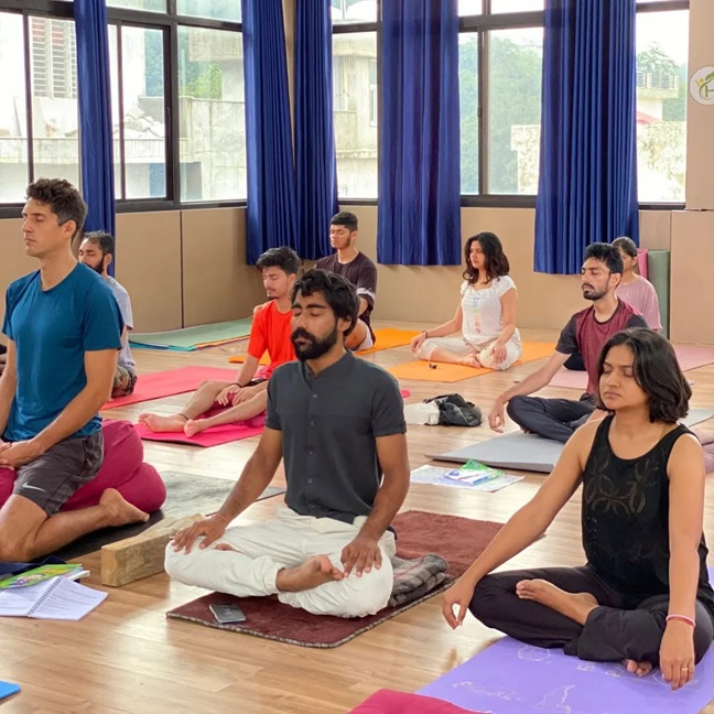 Student in Padmasana During Yoga Practice Session