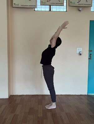 Surya Namaskar: The 12 Poses of Sun Salutation, Step by Step 11 Student Practicing Tadasana During the 12 Poses of Sun Salutation
