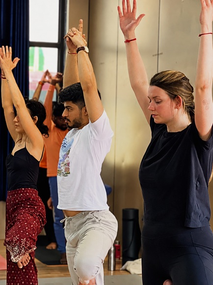 Students Practicing Vrikshasana (Tree Pose) During Yoga Session