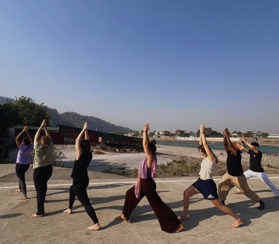 Student Performing Virabhadrasana I (Warrior Pose I)