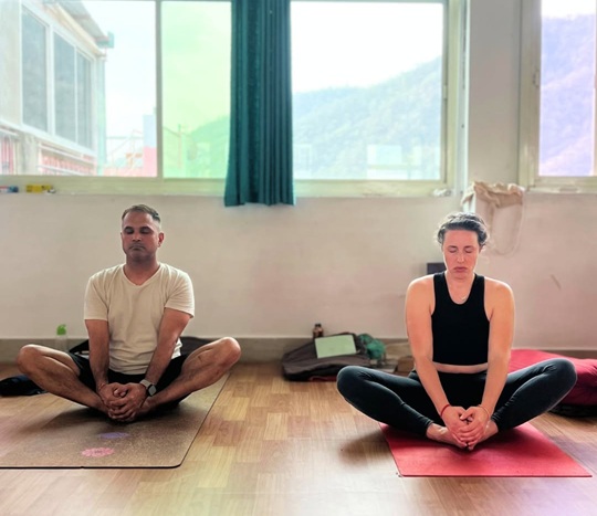 Students performing Bound Angle Pose
