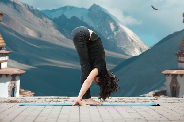 Woman Practising Hand-to-Foot Pose