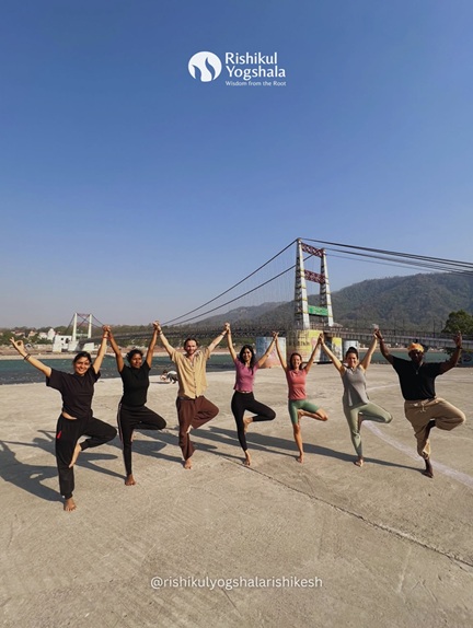 Students Practicing Vrikshasana (Tree Pose) During Outdoor Yoga Session