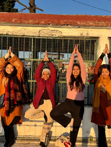 Students Practicing Vrikshasana (Tree Pose) During Yoga Session